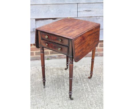 A 19th century mahogany flap top work table, fitted  two  drawers, on turned and castored supports, 21" wide x 35" deep x 28 