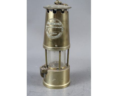 A miner's brass lamp, "The Protector", by Eccles of Manchester, 10 1/4" overall 