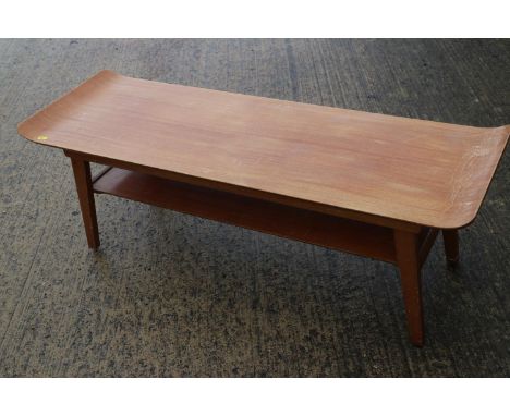 A 1960s teak low two-tier coffee table, 44" wide x 15" deep x 15" high 