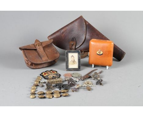 An early 20th century watercolour on paper portrait of a soldier, in silver frame, a leather pistol holster, a munition pouch