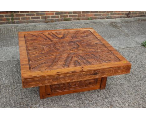 An African? carved hardwood square shaped coffee table, on block base, 42" square 