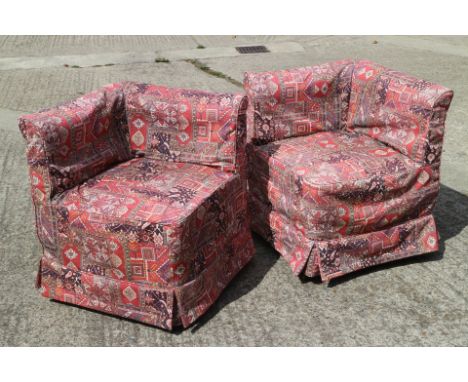 A pair of button back corner armchairs, upholstered in a gold fabric with pattered loose coversThe measurements are 23" squar