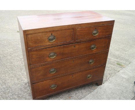 A 19th century mahogany chest of two short and three long graduated drawers with oval brass handle plates, on bracket feet, 3