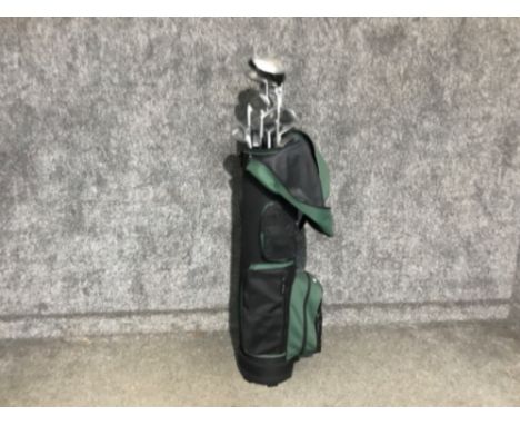 A golf bag containing Dunlop golf clubs