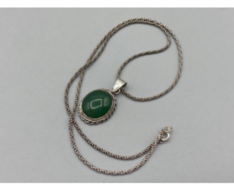 A silver and jade pendant necklace