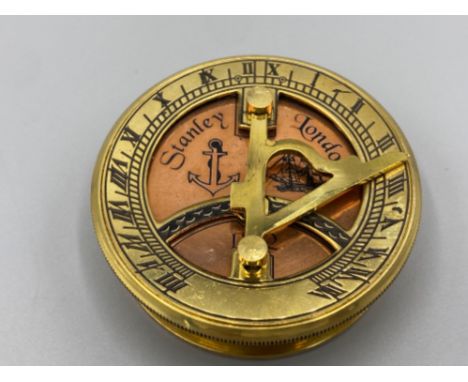 A brass compass and sundial