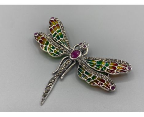 A large silver plique a jour butterfly brooch-pendant with ruby panel