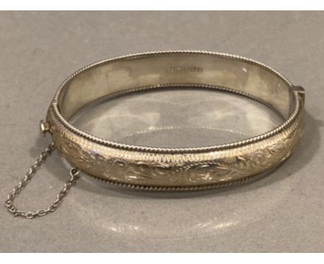 Silver, hollow half engraved bangle, 20.4g