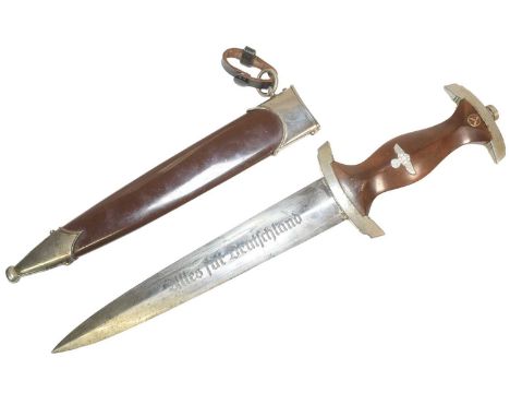 A WWII Second World War Third Reich Nazi German SA Officers dress dagger. The dagger having a shaped wooden grip with inset S