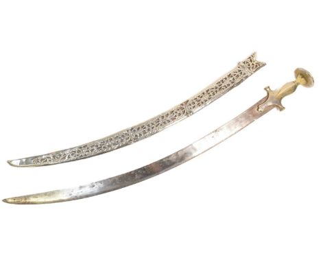 An early 20th Century Indian boys Tulwar sword having a flat disk shape pommel with ' flower head ' top, swollen grip and cro