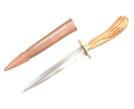 A WWII Second World War FS Fairbairn Sykes Commando dagger blade with a solid bone hilt and brass oval crossguard. Housed in 