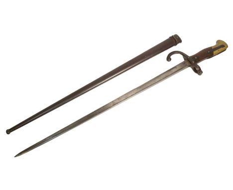 An original 19th Century French 1875 dated Gras rifle bayonet. The hilt with brass pommel and wooden grips encasing the tang 