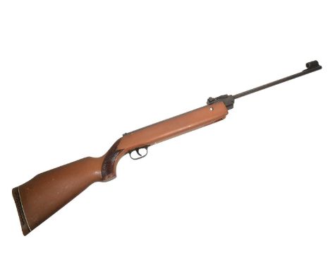 A vintage Diana model G80 spring powered break barrel air rifle. Wooden stock with texture hand grip and shoulder recoil pad.