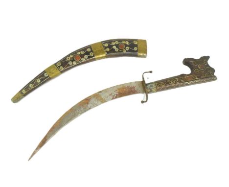 An early 20th Century North African Algerian / Moroccan Nimcha dagger. Carved wood handle with a distinct hooked pommel. Curv