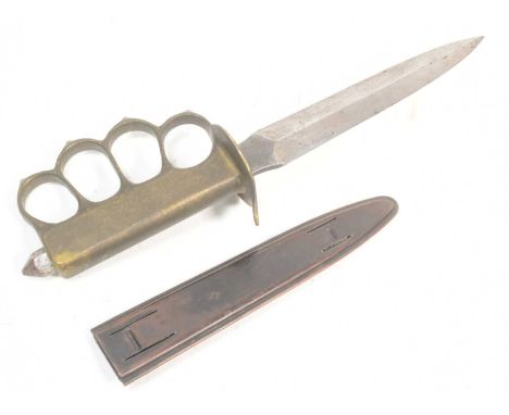 A WWI First World War US United States trench fighting knife dagger. Brass metal hilt with x4 large finger holes, spiked knuc