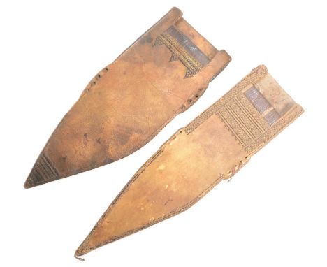 Two vintage East African Somali Billao dagger sheaths of thick hide construction with stitched decoration. Each measures appr