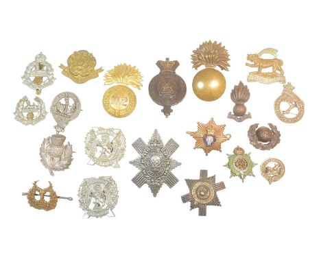 A collection of x20 assorted First and Second World War military uniform cap badges to include; East Lancashire Regiment, The