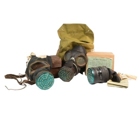 A collection of WWII Second World War respirator gas masks comprising x2 ARP Air Raid Precaution / Civilian examples with ori