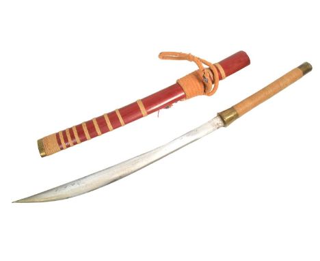 A vintage South East Asian Burmese Dha sword. Capped metal pommel and twine bound grip and a blade etched with curved incisio