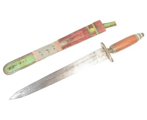 A North African silver mounted Tuareg dagger with a stacked pommel, wooden grip, crossguard and a tapering double edged blade