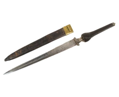 An 18th Century French reversible hilt plug bayonet. Black horn grip carved with sweeping channels unscrews at the neck and c
