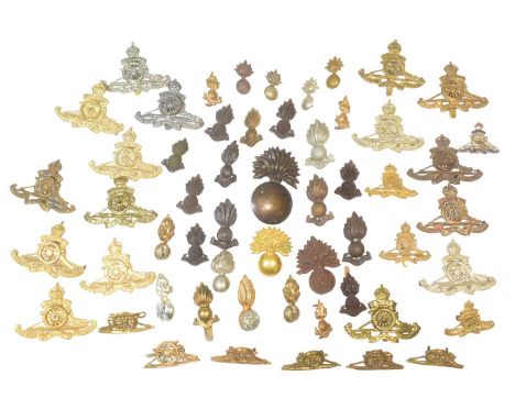 A collection of x26 First and Second World War British Artillery uniform cap badges to include; Volunteers, Cadets, West Ridi