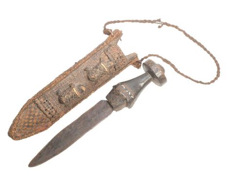 A vintage East African tribal dagger having a thick circular wooden pommel inlaid with copper squares, wide grip further inla