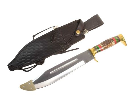 A vintage Rough Rider made Bowie knife having a polished brass hooked pommel, stag horn grip with black, red and green spacer