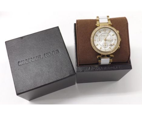 Michael Kors gold plated and ceramic lady's chronograph bracelet watch, ref. MK-6119, stone set bezel with silvered dial, qua