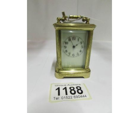 A miniature brass carriage clock