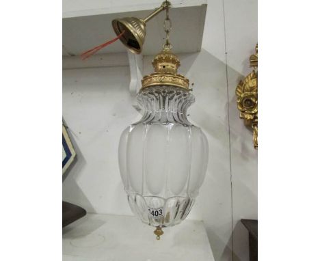 A glass and brass hall light