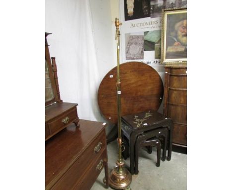 An adjustable brass standard lamp