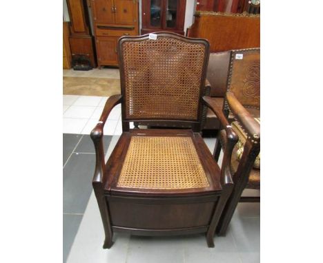 A mahogany commode with can seat and back (missing liner)