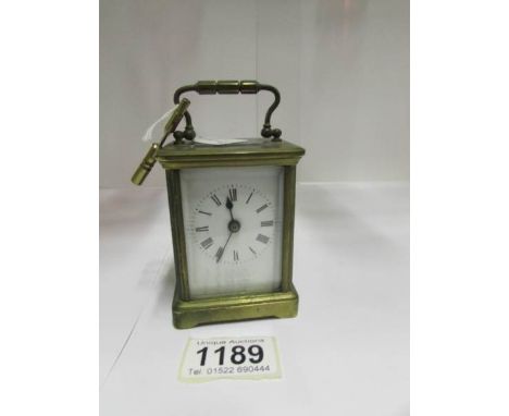 A small brass carriage clock
