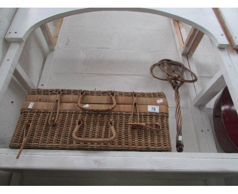 A Wicker picnic hamper and a carpet beater