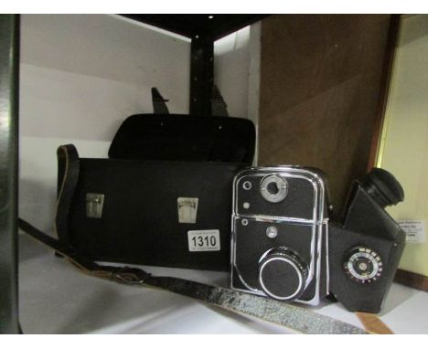 A Russian Kiev 88 camera body with film and cartridges