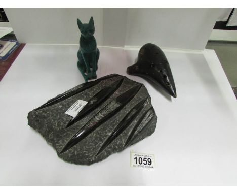 A fossil, a cat figure and an ochorina by Ewa, Austria