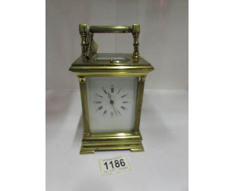 A brass carriage clock marked 'Patent JRety Puller'