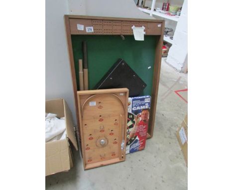 A set of pub skittles, a bagatelle and balls and a dart board