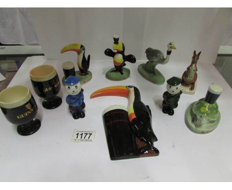 8 Carltonware Guinness items including toucans and 2 Carltonware golf figures, some a/f