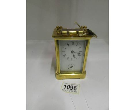 A brass carriage clock