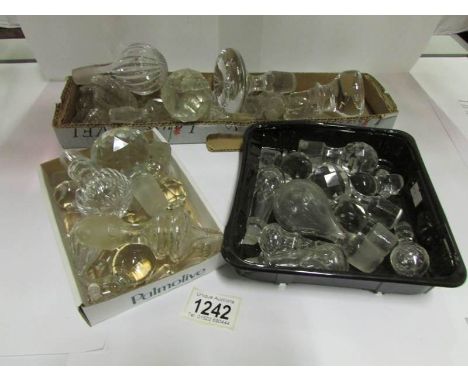 3 trays of glass decanter stoppers