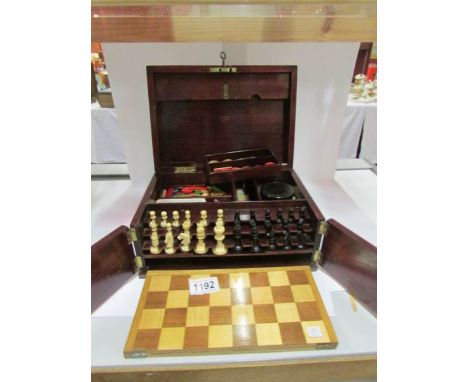 A Victorian rosewood games box containing bone chess set, counters, cards etc