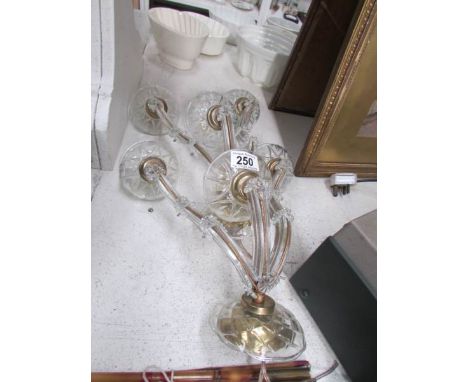 A pair of glass 3 lamp wall lights