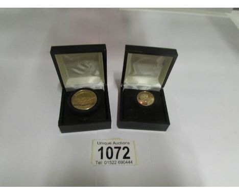 A USA bicentenial coin with George Washington portrait marked 500 fine gold and a Spirit of St. Louis coin marked 10k gold