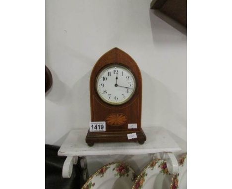 An inlaid mantel clock