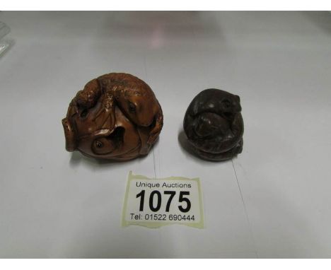 A Snake and frog netsuke with mother of pearl signed disc and a signed frog netsuke