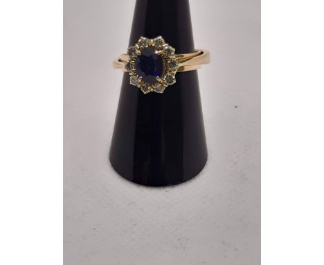 RING IN YELLOW GOLD DIAMETER 18 MM WITH SPRING. CENTRAL SAPPHIRE, MADONNA BLUE FOR CTS 1.20 BRILLIANT EDGE FOR CTS 0.25. GRAM