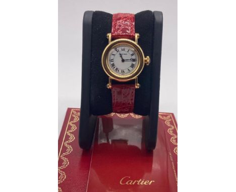 CARTIER brand  Model (Watch) DIABOLO  Reference number 1440 0  Quartz charge  Case material Yellow gold  Strap material  Skin