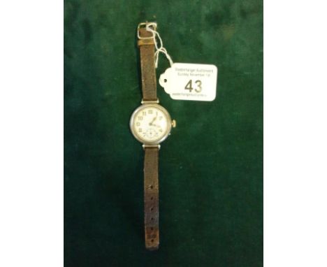 Gents 1920's Military Trench wristwatch, inscribed to back and dated 1920 on small leather strap in silver case, watch needs 